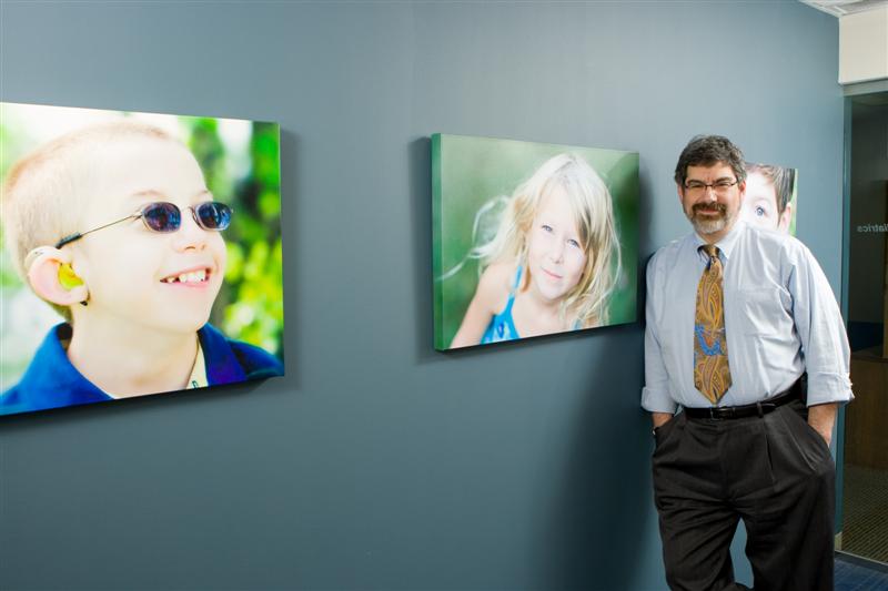 Dr. Rosen and some of the photographs he has taken, which are on display in the Department of Pediatrics Administrative Offices. More of Dr. Rosen’s photography can be viewed on his personal photography website.